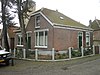 Dubbele hoekwoning in Overgangsstijl