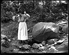 A Woman Drinks at the Carmen Spring, on West 175th Street and Amsterdam Avenue, New York City, by James Reuel Smith, c. 1897–1902