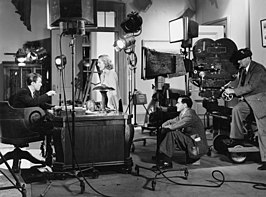 James Stewart, Jean Arthur, Frank Capra en Joseph Walker op de set