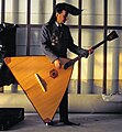 Silu Seppälä of Leningrad Cowboys, playing bass balalaika