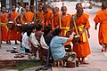 Image 25Monks gathering morning alms (from Culture of Laos)