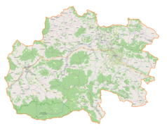 Mapa konturowa powiatu limanowskiego, blisko centrum u góry znajduje się punkt z opisem „Tymbark”