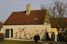 A small two-story farmhouse