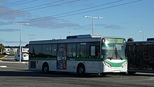 A Transperth Mercedes-Benz bus that is not in service, showcasing a Sonic the Hedgehog 2 poster on its side.