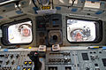 Good (left) and Reisman look through the aft flight deck windows of Atlantis during EVA 3.