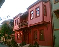 A newly restored old pink colored house