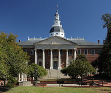 A large, impressive public building, with a pillared facade and a cupola