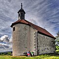 Gangolfskapelle (1597). Saalbau mit zweitem Geschoss als Glockenstube, halbrunde Apsis