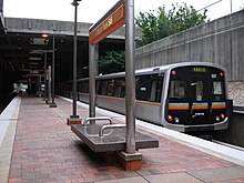 MARTA AnsaldoBreda CQ312 Gold train leaving College Park Station