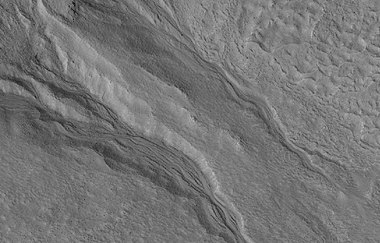 Close view of gullies, as seen by HiRISE under HiWish program. Streamlined features are visible in gully channels.