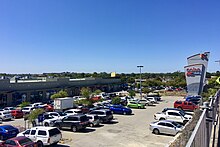 Shopping centre and car park viewed from an elevated position