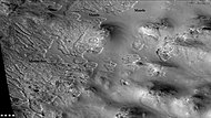 Channels and mantle, as seen by CTX camera (on Mars Reconnaissance Orbiter). Channels are exposed where the mantle has disappeared. Mantle falls from the sky during certain climates. Note: this is an enlargement of the previous image of Perepelkin Crater.