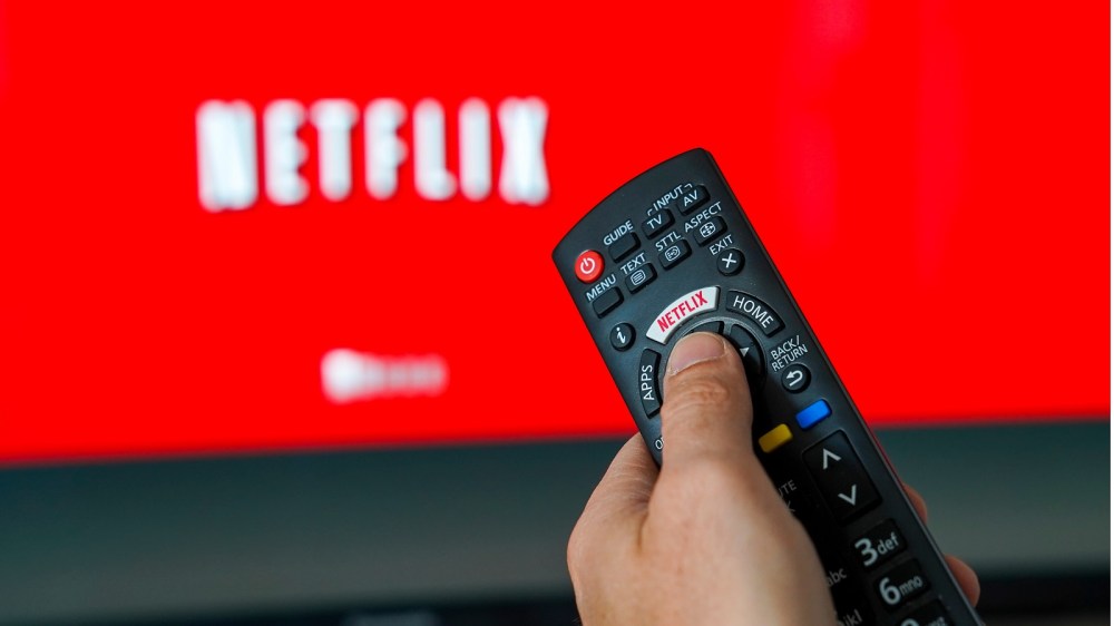 Illustration of the video streaming company Netflix. Logo Netflix on the keyboard of a remote control in front of a TV.Netflix, Belgium - 01 Apr 2019