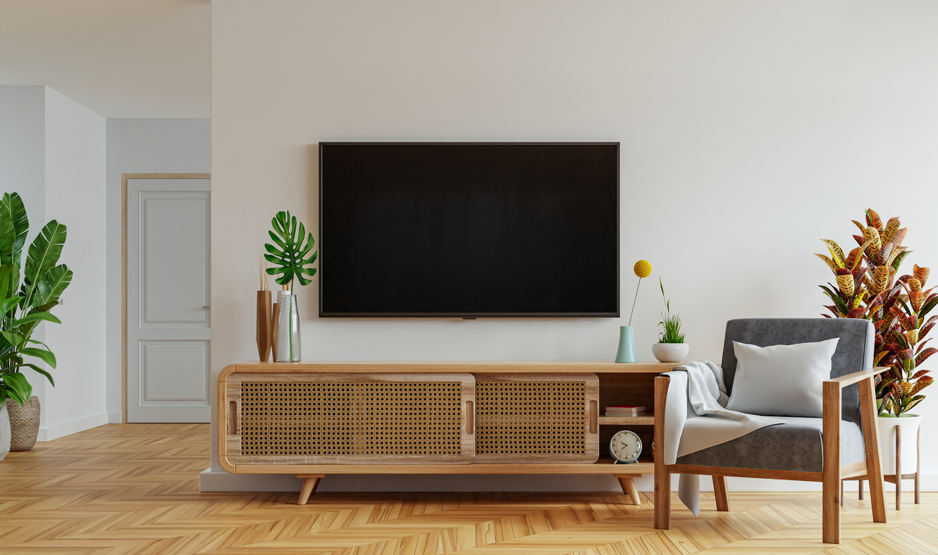 A flat screen TV hangs on the wall in a modern living room.