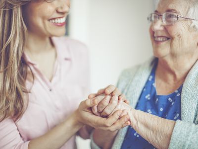 An older woman with her caregiver