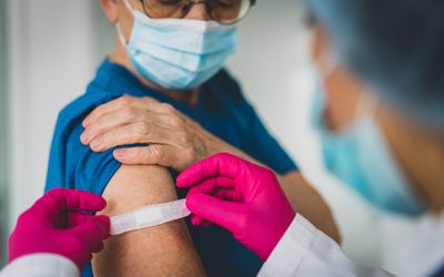 Senior woman getting vaccinated