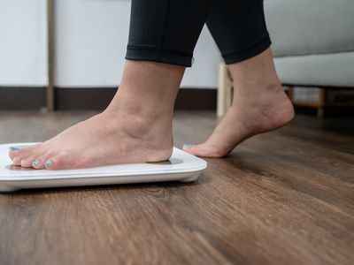 feet standing on electronic scale