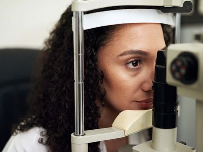 woman receiving dilated eye exam