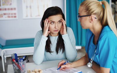 a patient consulting with a doctor