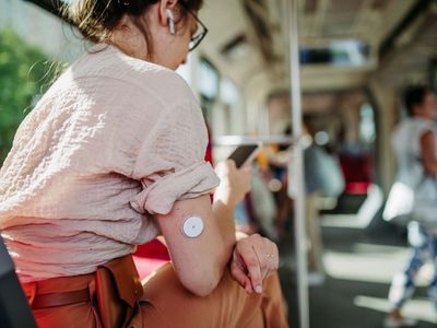 woman with continuous glucose monitor