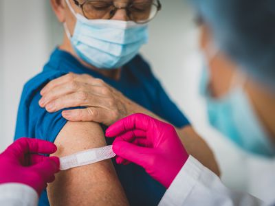 Senior woman getting vaccinated