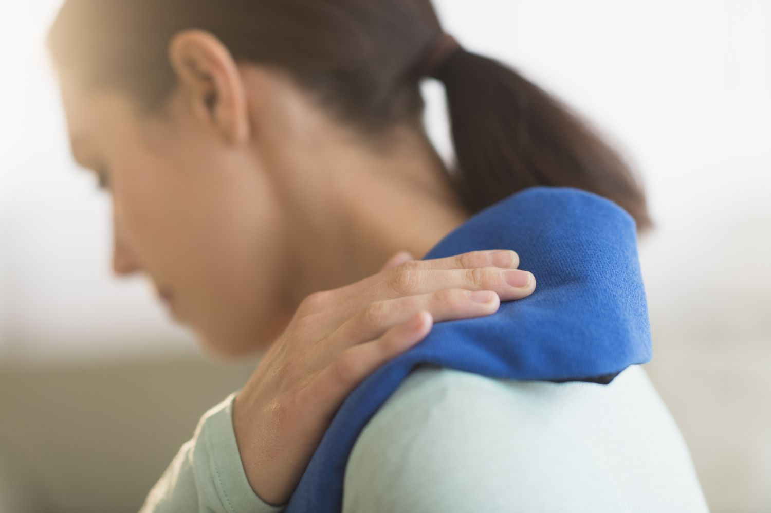 Woman using heating pad