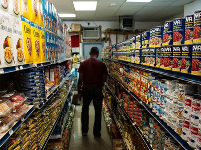 A man in an aisle at the market