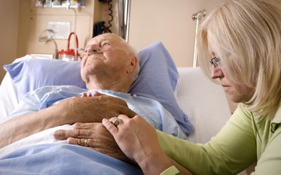 elderly man in hospital bed