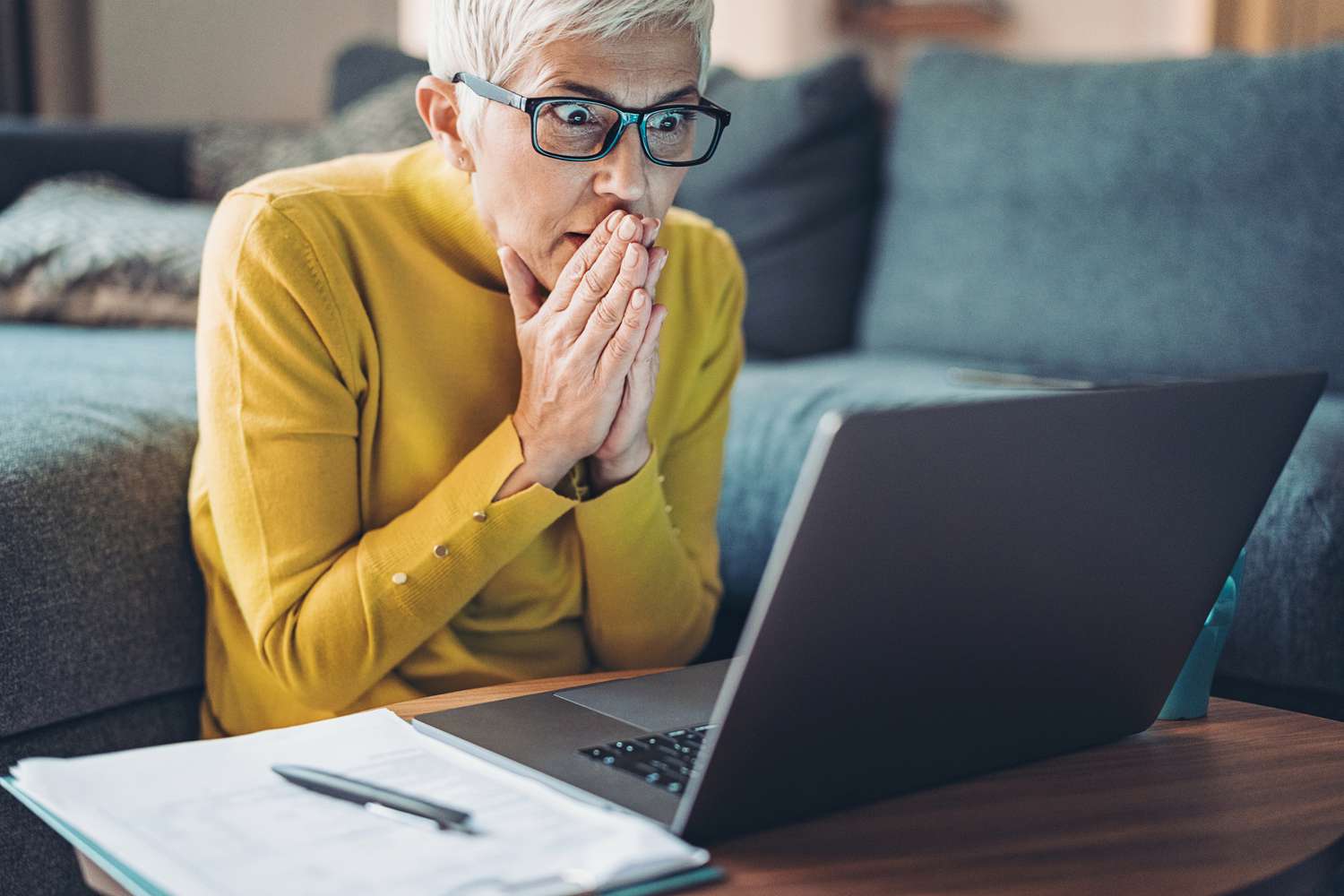 Woman looking at computer, concerned about possible Medicare abuse