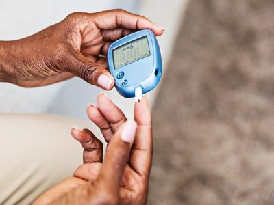 woman with diabetes checking her blood sugar