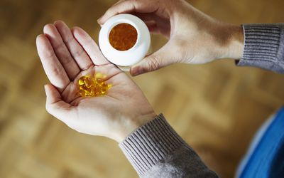 supplements in woman's hand