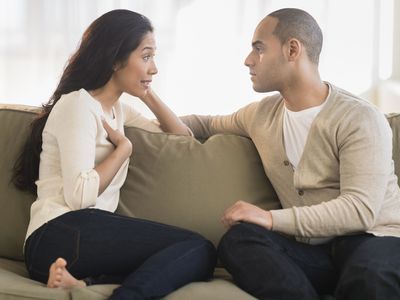 A picture of a man and a woman having a serious talk