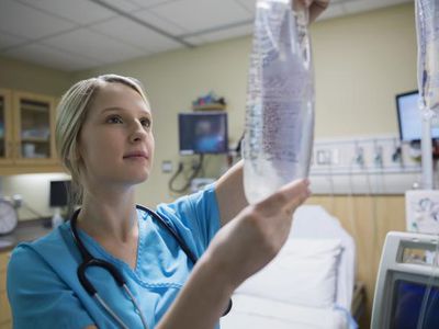 Nurse checking an iv bag