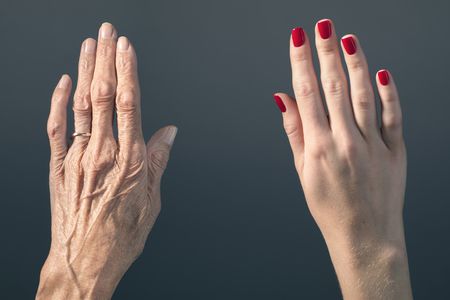 An older hand vs. a younger hand