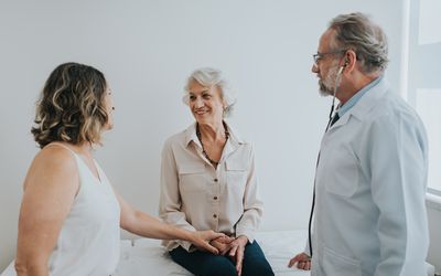 An older woman with her daughter at a doctor's appointment