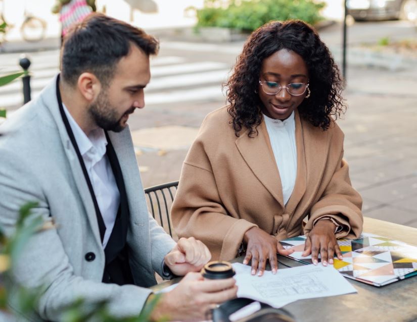 A hero image that displays various photos of Trustpilot employees in the office as well as visitor insights to showcase how Trustpilot can help businesses reach more customers