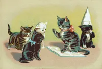 Vintage illustration of five kittens in a classroom scene. A grey tabby kitten wearing a pink bow sits upright on an open book, one paw raised as if reciting or answering a question. Facing it are a brown tabby kitten, a white kitten, and a black kitten with a light blue bow, watching attentively. At the far right, a black-and-white kitten wearing a tall pointed 'DUNCE' cap covers its face with one paw in shame. The scene has a mottled sepia-and-gold background typical of Victorian-era chromolithograph cards.
