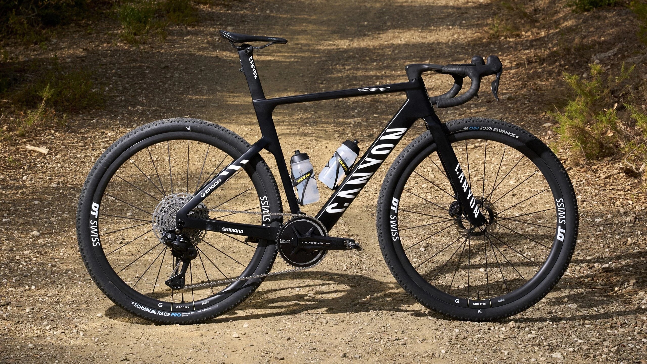 A black Canyon Grail CFR on a gravel trail 