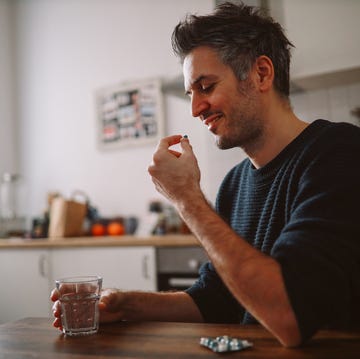 man taking medicine