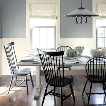 a dining room area with light blue paint in the background