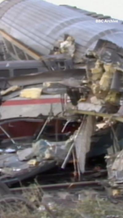A train wreckage is lying on the ground.