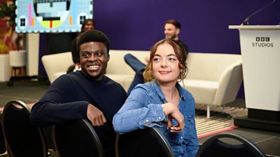 Two BBC colleagues sitting together