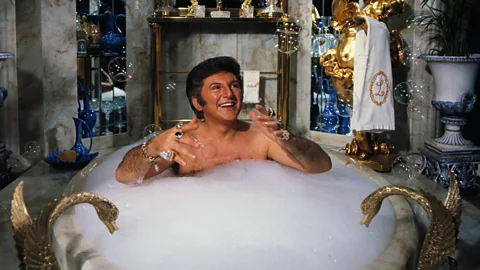 Liberace in a bubble bath at his home (Credit: Getty Images)