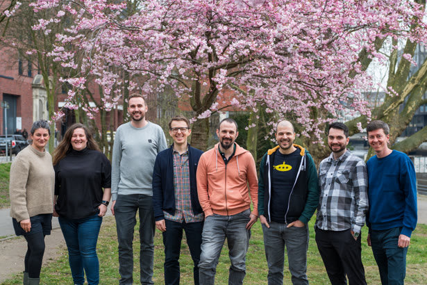The Private Packagist team under a cherry tree in Hamburg